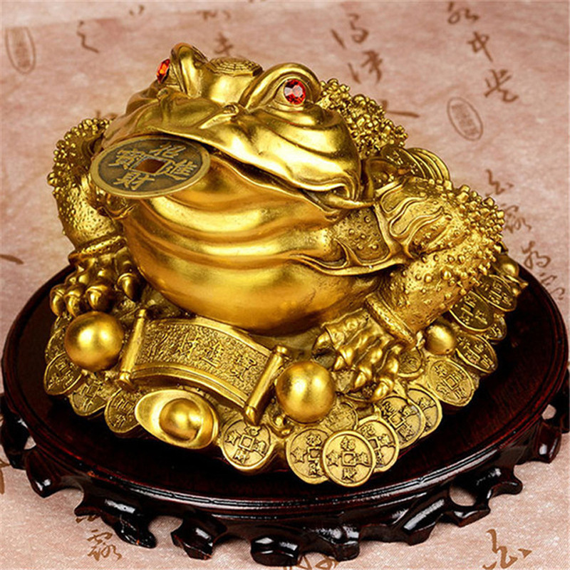 A Feng Shui brass three legged golden toad ornament that attracts wealth and enhances wealth energy